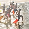 swimmers in a race at the beach