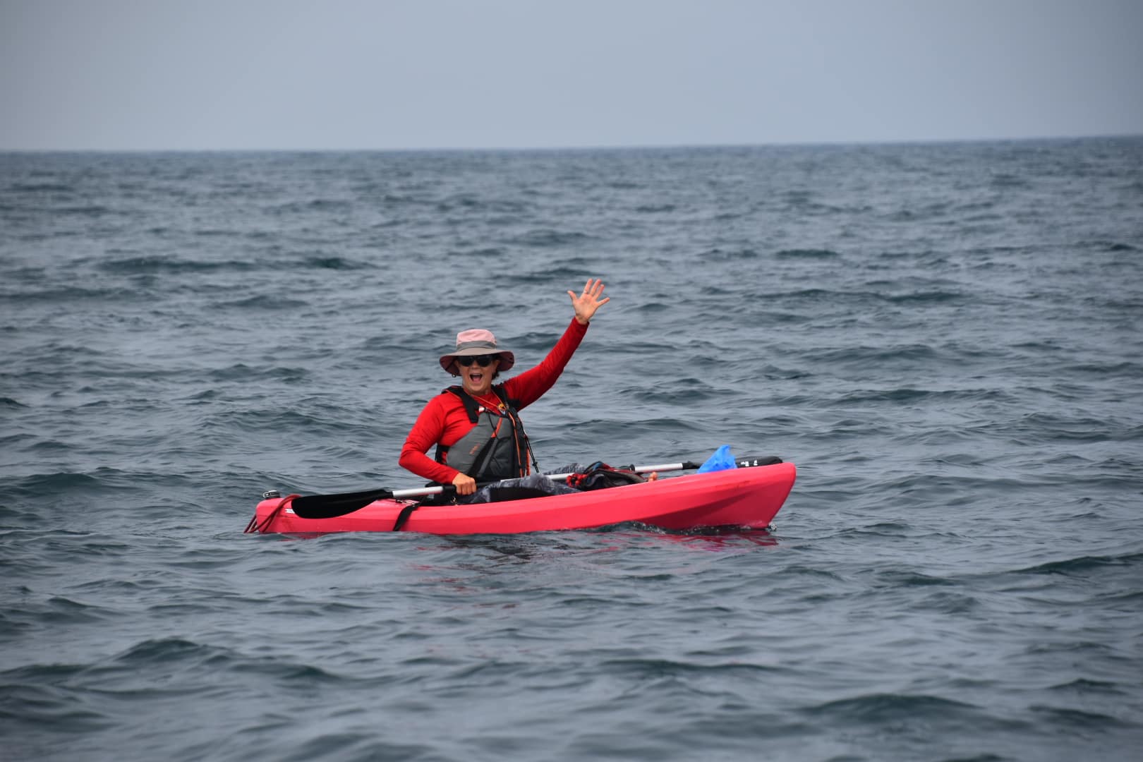 A happy woman in a kayak tour